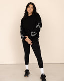 women oversized black sweatshirt front view