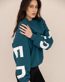 women oversized blue sweatshirt side view