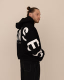 men oversized black hoodie side view