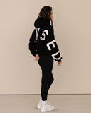 Women oversized black hoodie side view