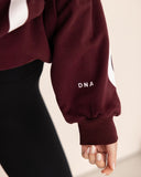 Women oversized burgundy hoodie arm view