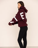 Women oversized burgundy hoodie side view