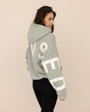 Women oversized green hoodie side view