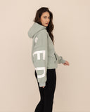 Women oversized green hoodie side view