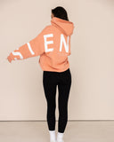 Women oversized orange hoodie back view