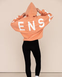 Women oversized orange hoodie back view