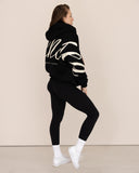 women oversized black hoodie side view