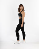 Women black legging side view