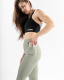Women green legging pocket side view