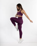 Women purple legging back view movement 