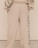 women oversized beige pantalon back view