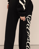 women oversized black pantalon back view