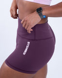 women purple short side view